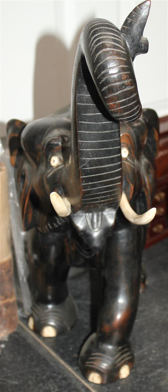 A large Indian ebonised carved hardwood elephant, 21in.